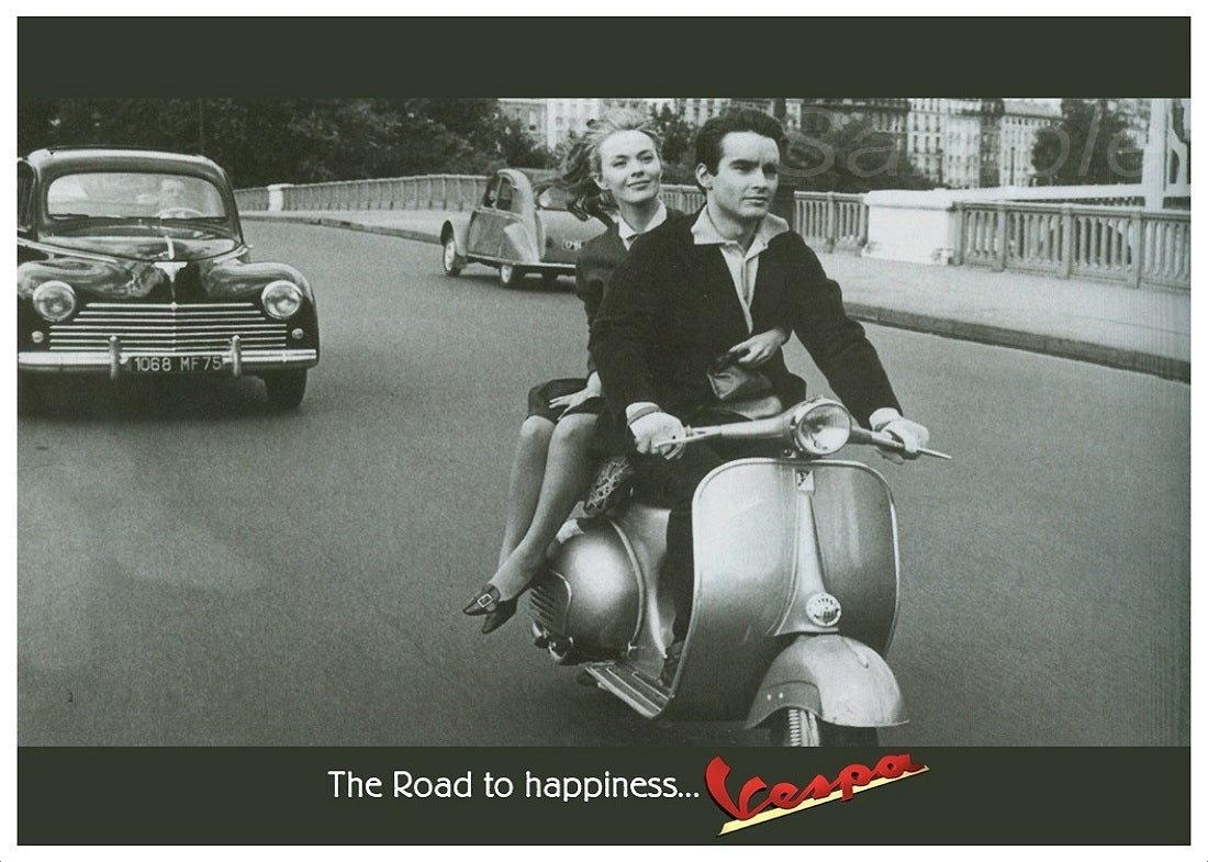 A vintage advertisement poster of a man and woman riding a Vespa scooter with the text 'The Road to Happiness... Vespa'.