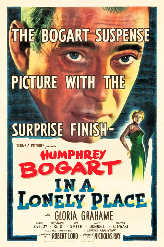 Vintage movie poster featuring Humphrey Bogart with the text 'THE BOGART SURPRISE FINISH' and the title 'IN A LONELY PLACE' along with the names of the cast including Gloria Grahame and Robert Mitchum.