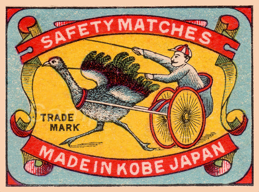 Vintage safety matches packaging with a man and bird illustration, made in Kobe, Japan.
