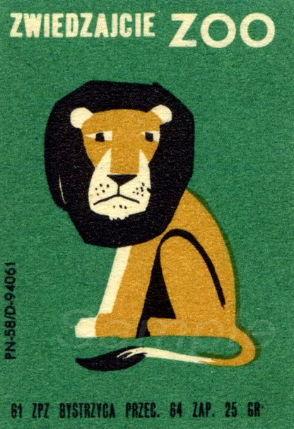 Matchbox label with a lion illustration on a green background, featuring the text 'ZWIEDZAJCIE ZOO'.